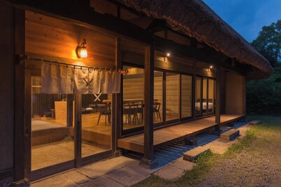 Chigi Terrace A traditional thatched roof house  / Koyu-gun Miyazaki