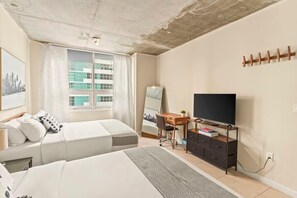 1 bedroom, desk, iron/ironing board, travel crib