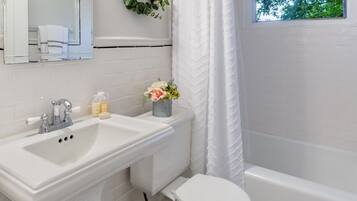 Combined shower/bathtub, hair dryer, towels, soap