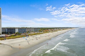 On the beach, sun loungers, beach towels