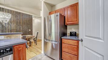 Microwave, dishwasher, coffee/tea maker, dining tables