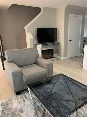 TV, fireplace, table football, books