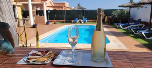 4 bedroom LUXURY villa with AC, private heated pool, XBOX and all the amenities!