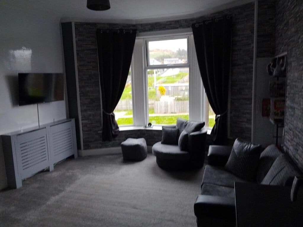 Smart TV, fireplace, books