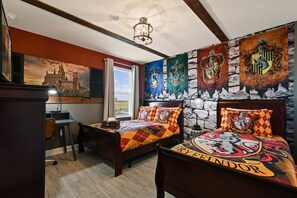 A bedroom with two beds, a desk, and a large window. - Star Wars Bunks, Harry Potter Beds & Frozen Room! (Davenport)
