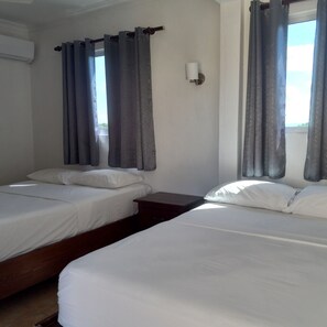 Classic Quadruple Room | Pillowtop beds, blackout drapes, free WiFi, bed sheets - Ensenada Resort (Villa Isabela)