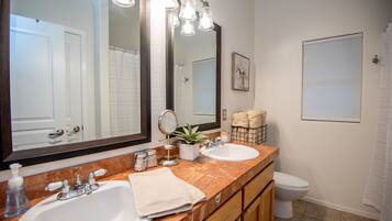 Combined shower/bathtub, hair dryer, towels, soap