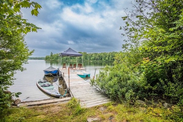 Scenic lakeside view with a boat—ideal for peaceful moments and nature adventures.