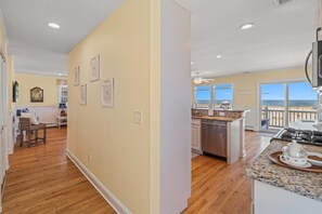 Enjoy ocean views from the kitchen window, where a central island offers ample space for cooking and a stove and sink are at your fingertips.