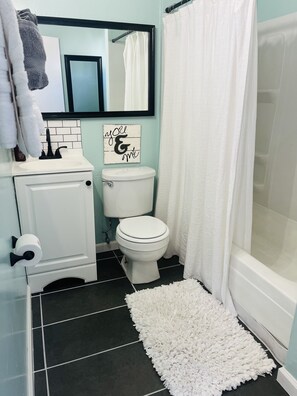 Combined shower/bathtub, hair dryer, towels, soap