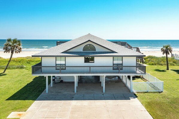 A beachfront house with a balcony, a covered patio, and a view of the ocean. - Beachfront w/ Rooftop Deck, Dune Walkover & Nearby to Jamaica Beach Amenities (Jamaica Beach)