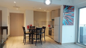 Fridge, microwave, oven, stovetop - Stylish Suite on Yas island with sea view balcony, near mall, theme parks. (Abu Dhabi)