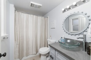 Combined shower/tub, hair dryer, towels, soap