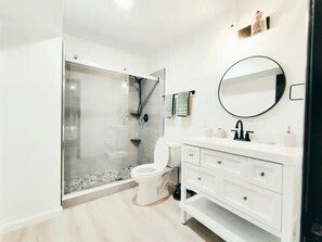 Shower, hair dryer, towels, soap