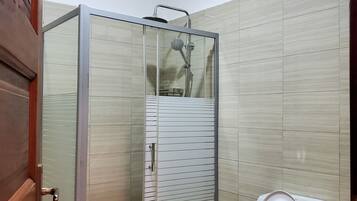Shower, towels, soap, toilet paper