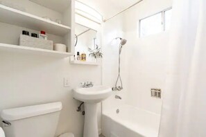 Combined shower/tub, hair dryer, towels, soap