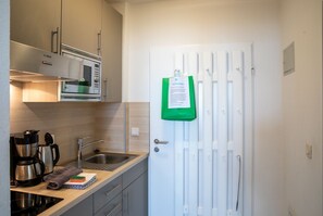 Fridge, microwave, stovetop, coffee/tea maker