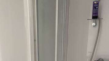 Shower, towels, soap, toilet paper