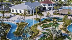 A resort with multiple swimming pools, a golf course, and a large building with a red roof. - Storey Lake Resort, Private Pool, and Much More!! (Kissimmee)