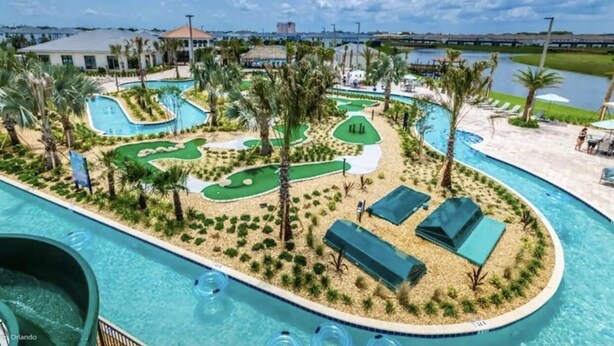A resort with a pool area, palm trees, and a golf course. - Storey Lake Resort, Private Pool, and Much More!! (Kissimmee)