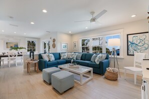 Téléviseur connecté, table de ping-pong, livres, chaîne audio