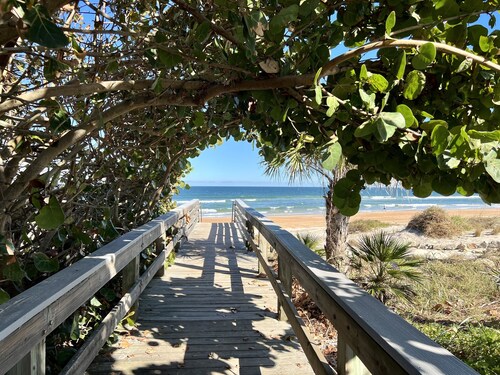 Walk to the beach! Spacious home with comfy beds, game room, & fenced yard. 