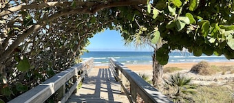 Walk to the beach! Spacious home with comfy beds, game room, & fenced yard.