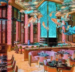 Relax in style with plush seating and a striking central sculpture.