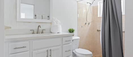 Combined shower/tub, hair dryer, towels, soap