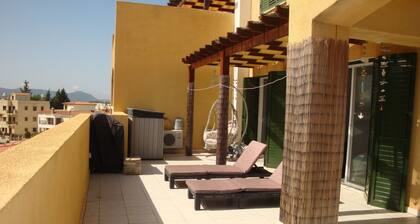 Spacious apartment with very large balcony close to all amenities