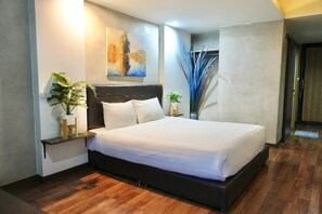 Habitación doble Deluxe | Ropa de cama de alta calidad, camas con pillow-top y cortinas blackout