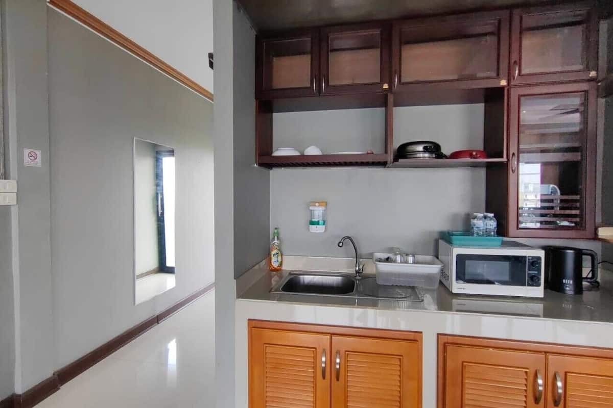 deluxe quadruple room | premium bedding, pillow-top beds, individually decorated