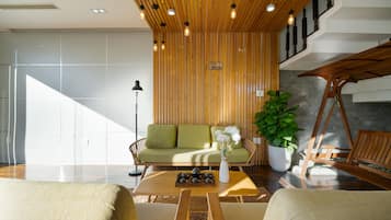 Deluxe Villa | Living area | 55-inch Smart TV with cable channels, TV, Netflix