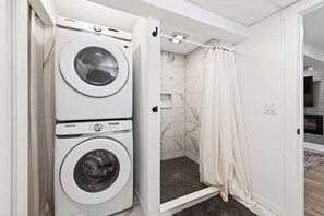 Shower, hair dryer, towels