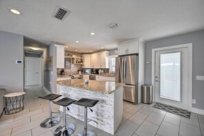 Dishwasher, cookware/dishes/utensils, paper towels, dining tables