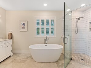 Bathtub, towels, toilet paper
