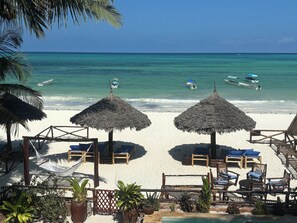 On the beach, sun-loungers, beach towels
