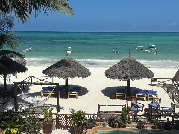 On the beach, sun-loungers, beach towels