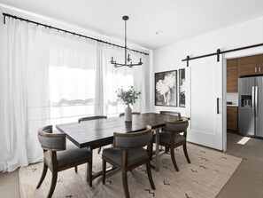 Enjoy meals in this elegant dining room with a large table and six comfortable chairs.