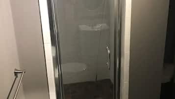 Shower, towels, soap, toilet paper