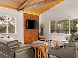 Sink into the leather recliners and let the pine ceiling do the rest. Netflix on, forest outside, nowhere to be. - Open Air Cinema & Hot Tub | Restored Log Cabin (Conifer)