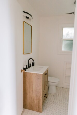 Combined shower/tub, hair dryer, towels, soap