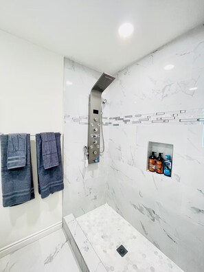 Combined shower/tub, hair dryer, towels, soap