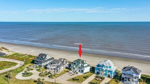 A coastal residential area with houses near the beach.