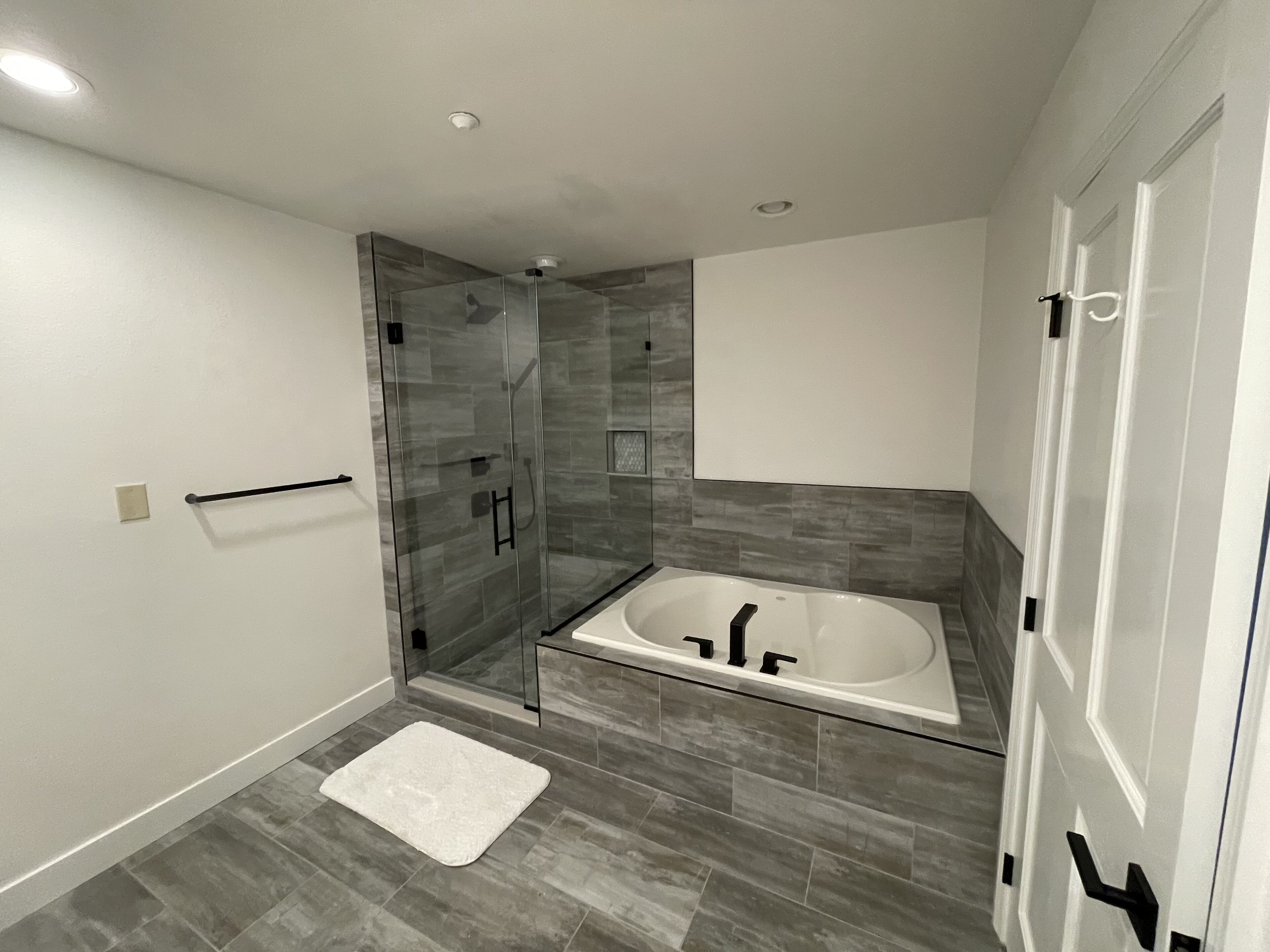 Bathtub, hair dryer, towels, soap
