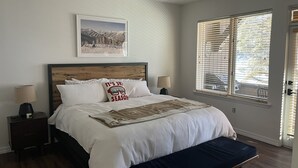 A bedroom with a bed, a ceiling fan, a window with blinds, and a framed picture on the wall. - Gorgeous Ski-In Ski-Out Condo on Beaver Creek Mountain (Beaver Creek)