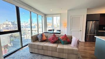 Deluxe Apartment, 1 Bedroom | Living area | 55-inch Smart TV with digital channels, TV, Netflix