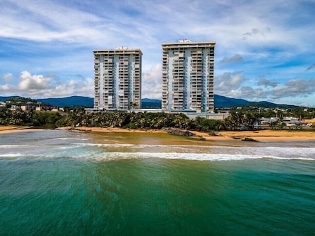 On the beach, sun loungers, beach towels. Beach Front and river mouth front near El Yunque Rain Forest!