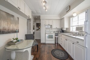 Enjoy cooking in this well-equipped kitchen with a microwave, oven, and sink.