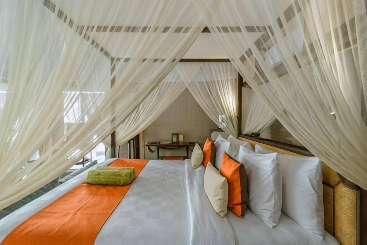 A room with a bed, a table, and a chair.